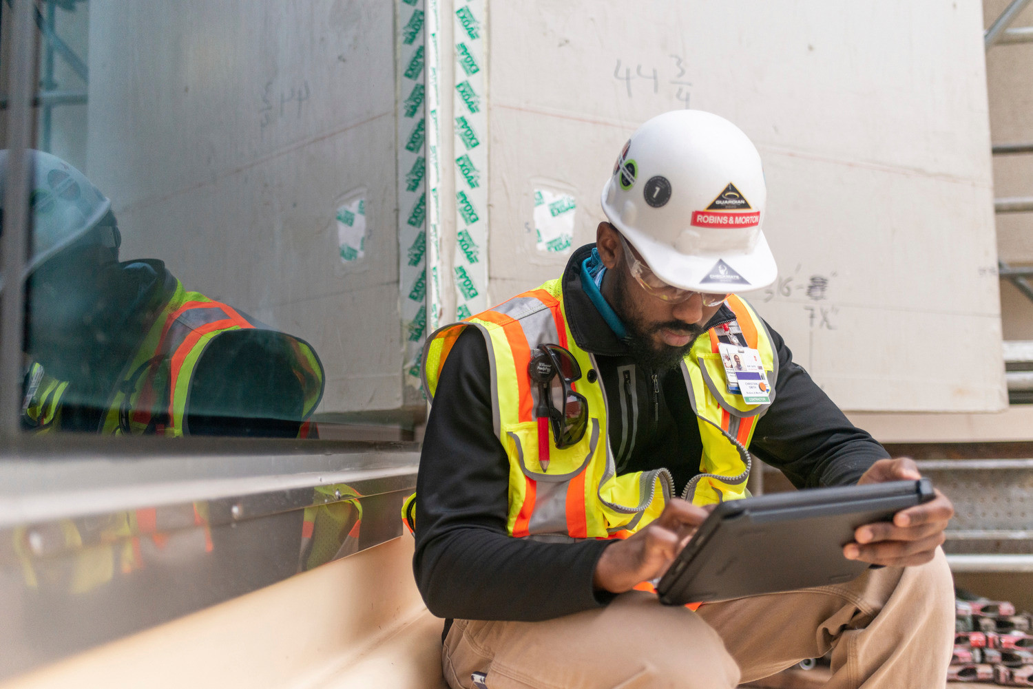 Robins and Mortin employee on ipad