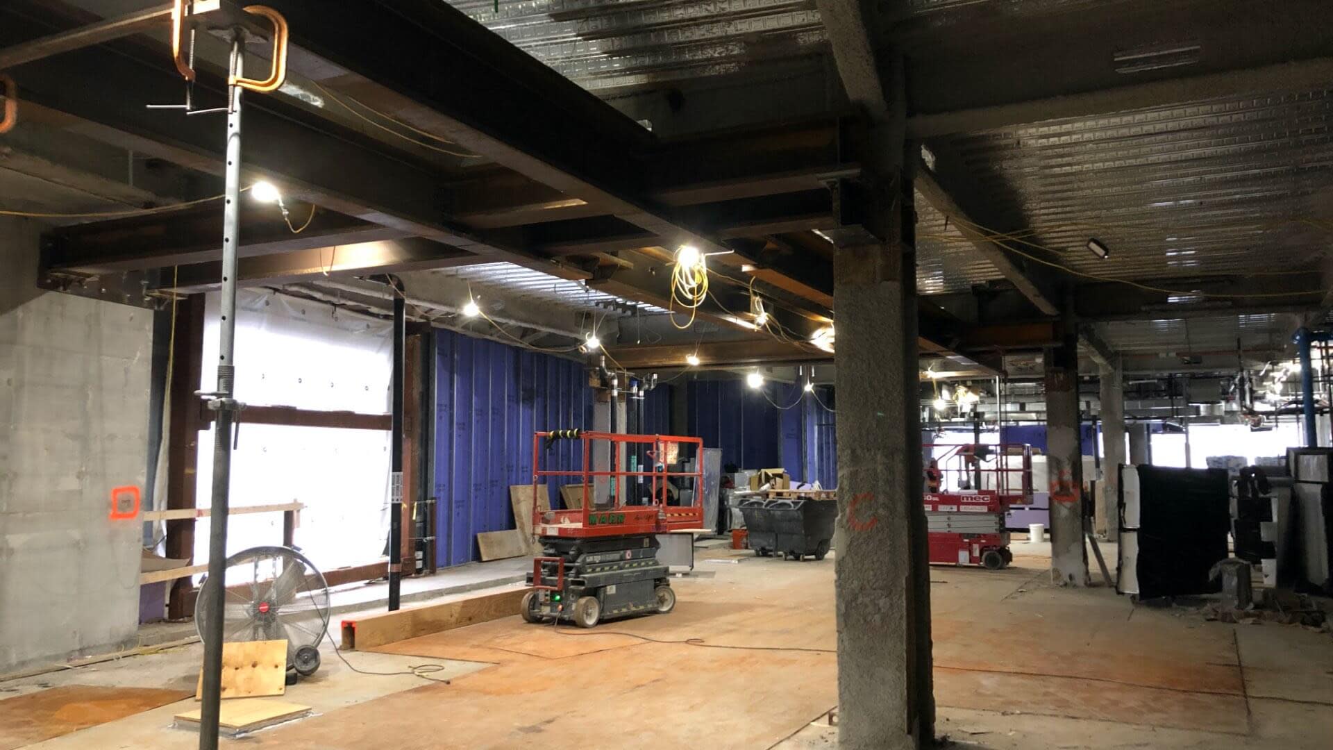 Interior of an under construction project with large metal beams
