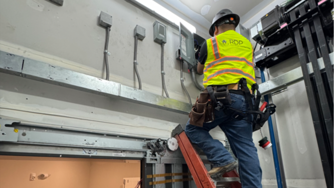 RDP Electricians on a ladder