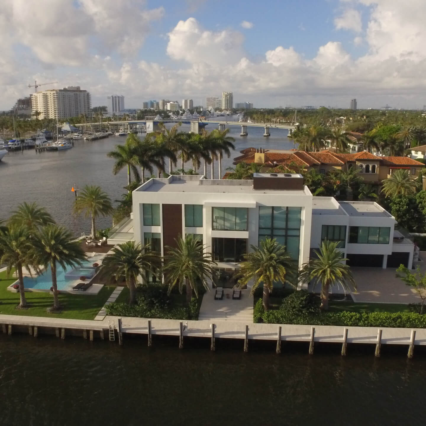 Aerial view of a boathouse and city skyline