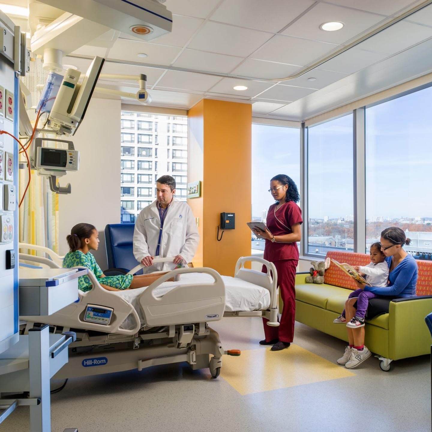 Patient with his family and doctor in a room of the Children's Hospital