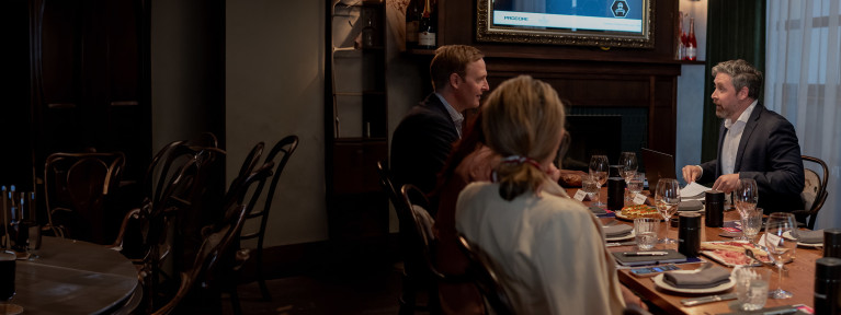 a group of people sitting at a table