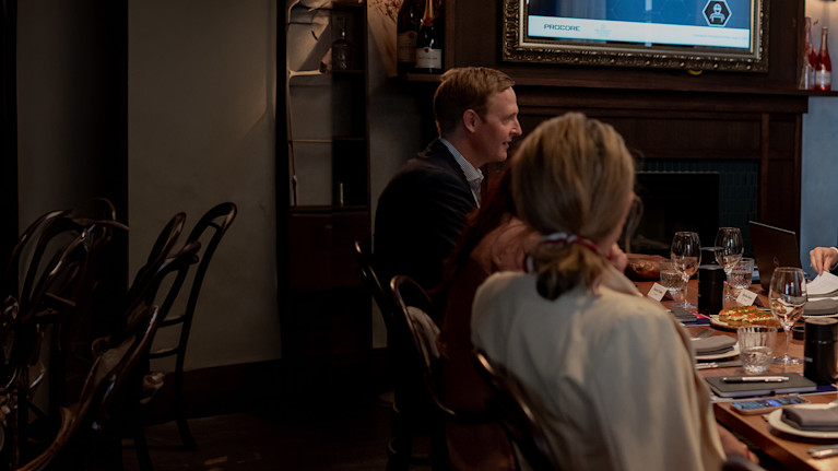 a group of people sitting at a table