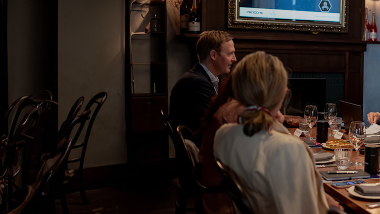 a group of people sitting at a table