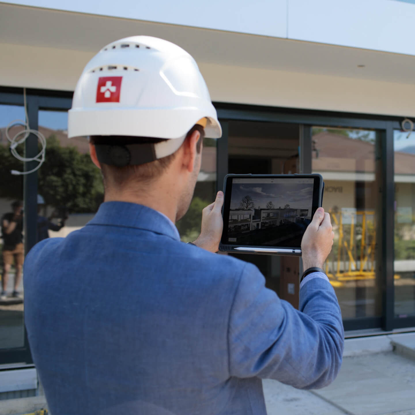 Swissroc worker using Procore on a tabler