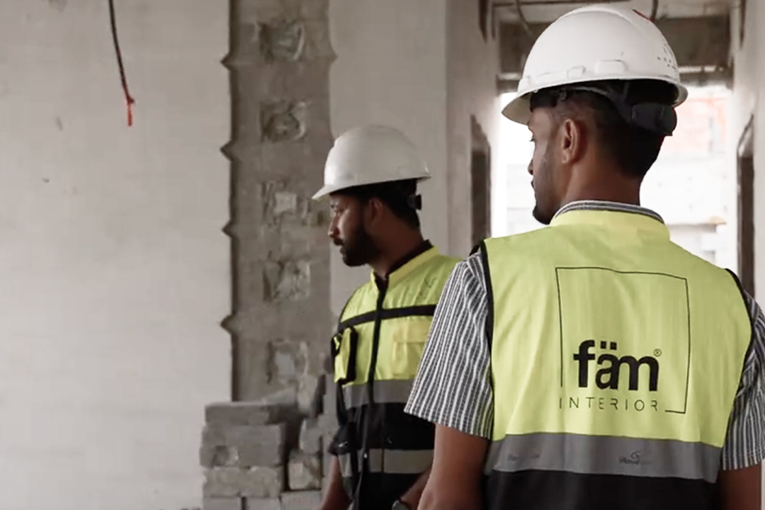 Two fam interiors workers at a construction site