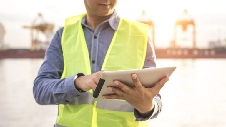 A contractor using a tablet