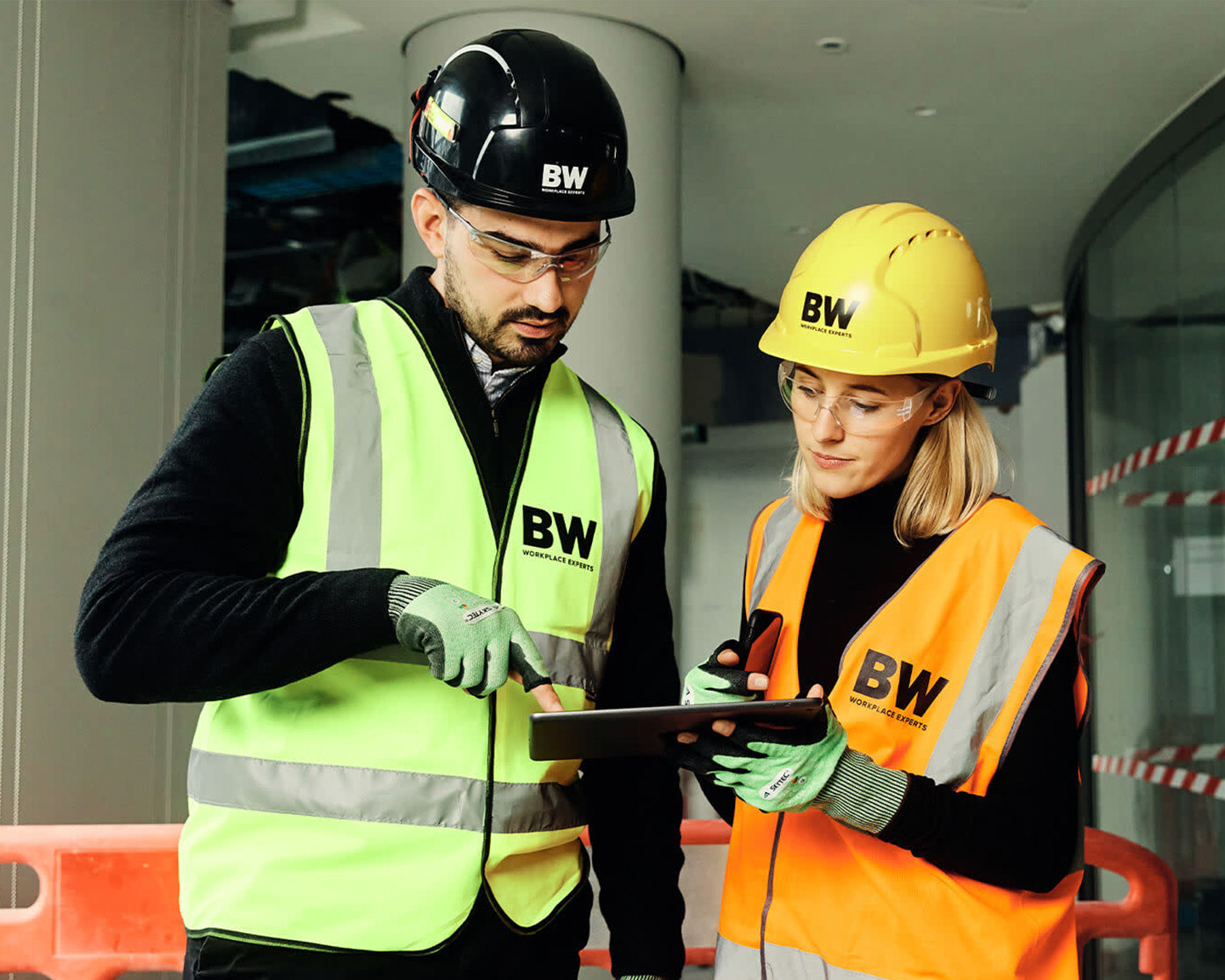 Construction workers using mobile devices on a jobsite