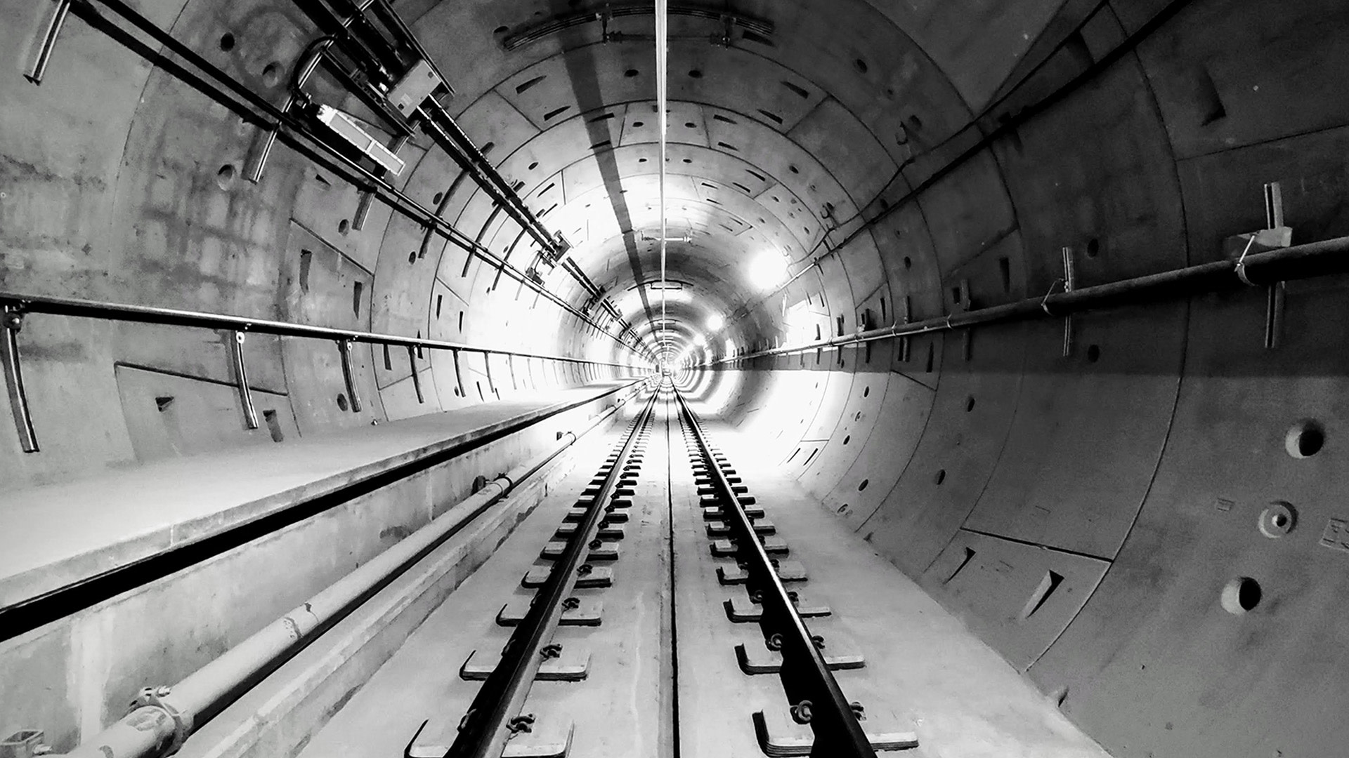 a tunnel with train tracks