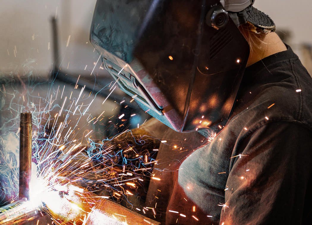 Construction woman welding