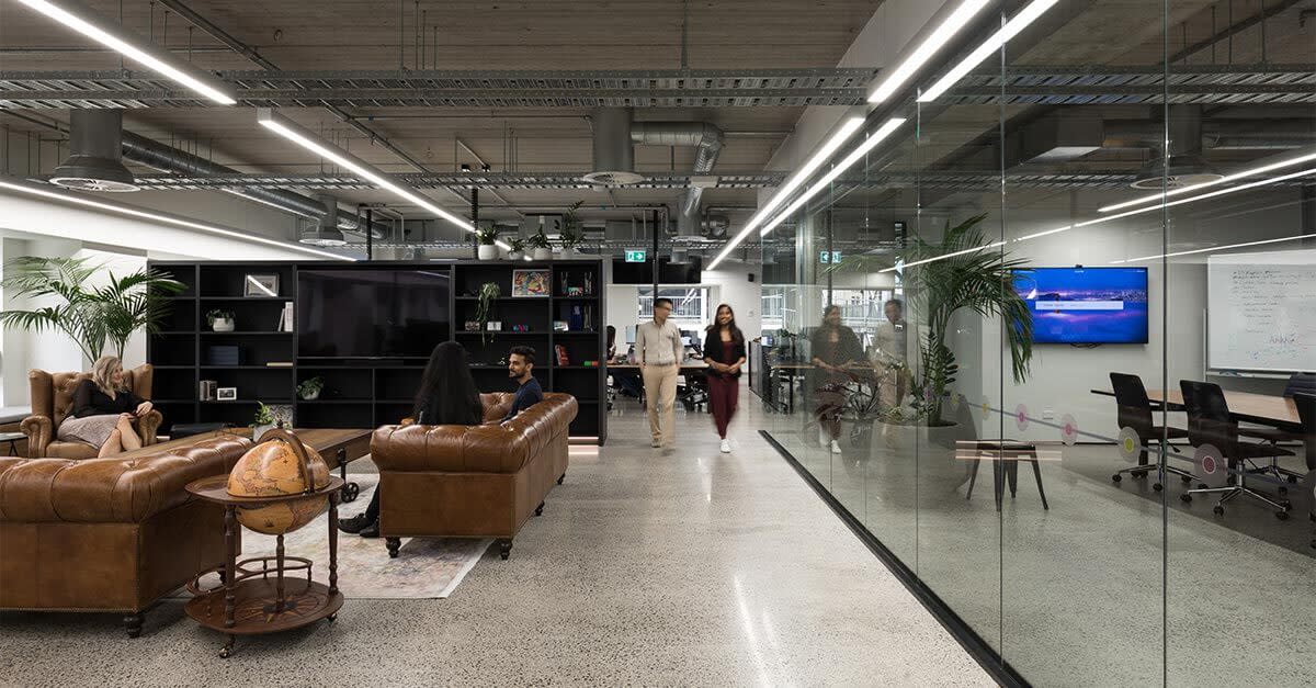 People walking inside an office space