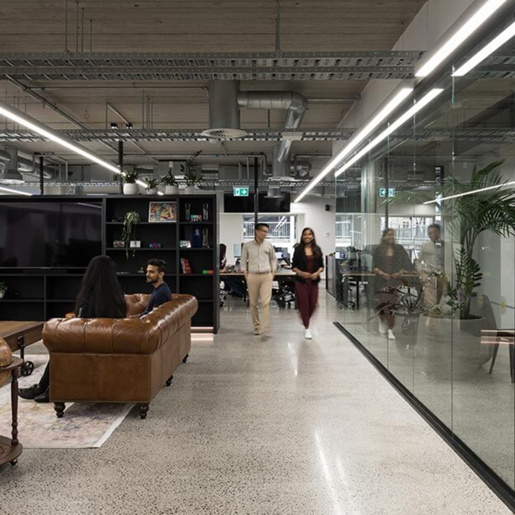 People walking inside an office space