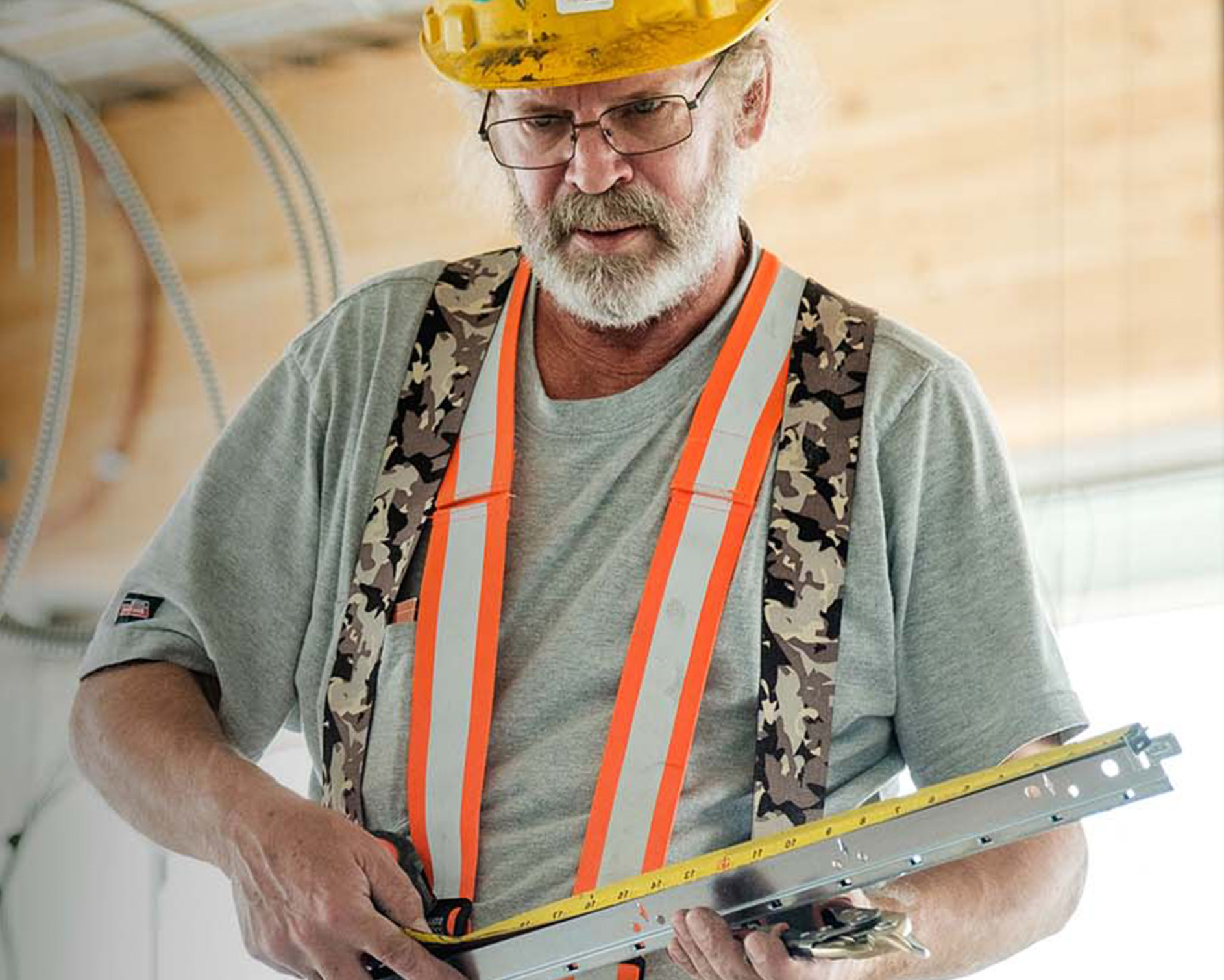 Contractor taking measurements