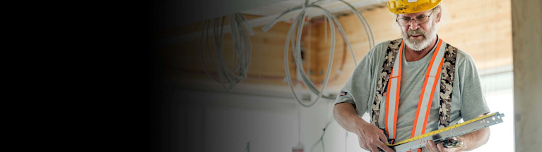 Contractor taking measurements