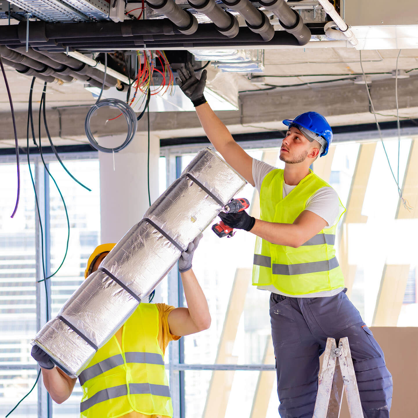 Contractors setting up cords on the ceiling