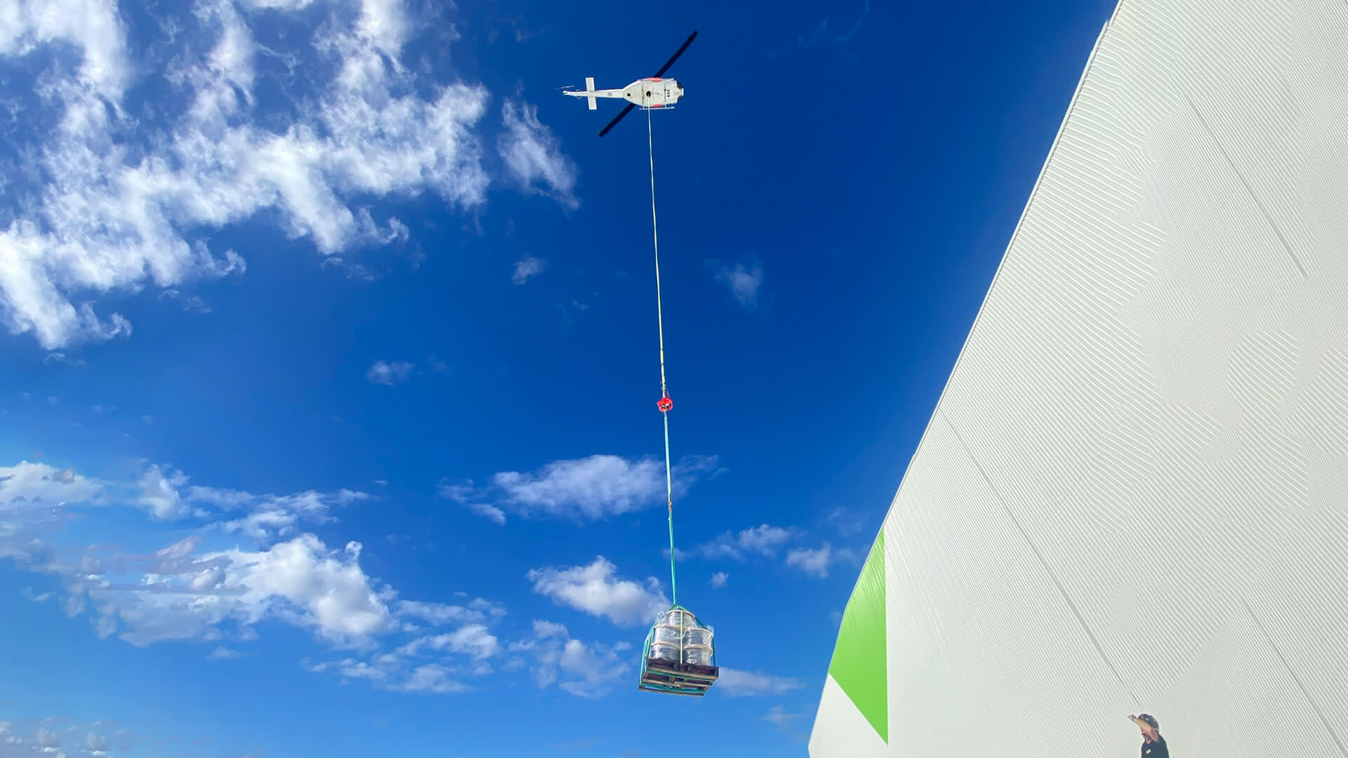 A helicopter carrying metal pieces