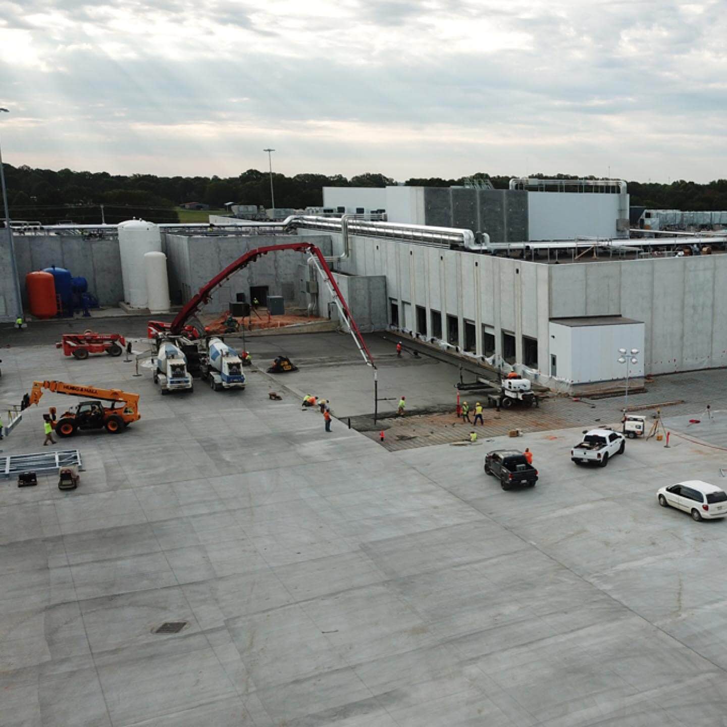 Pouring concrete at a large factory build