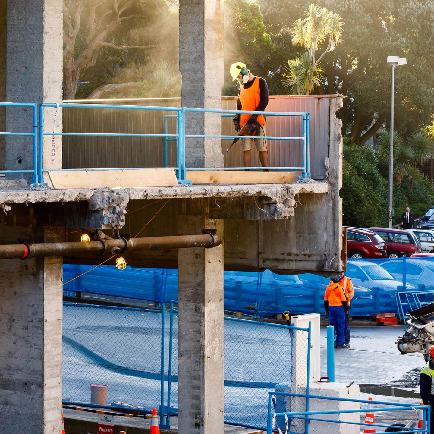 Construction workers finishing up a building