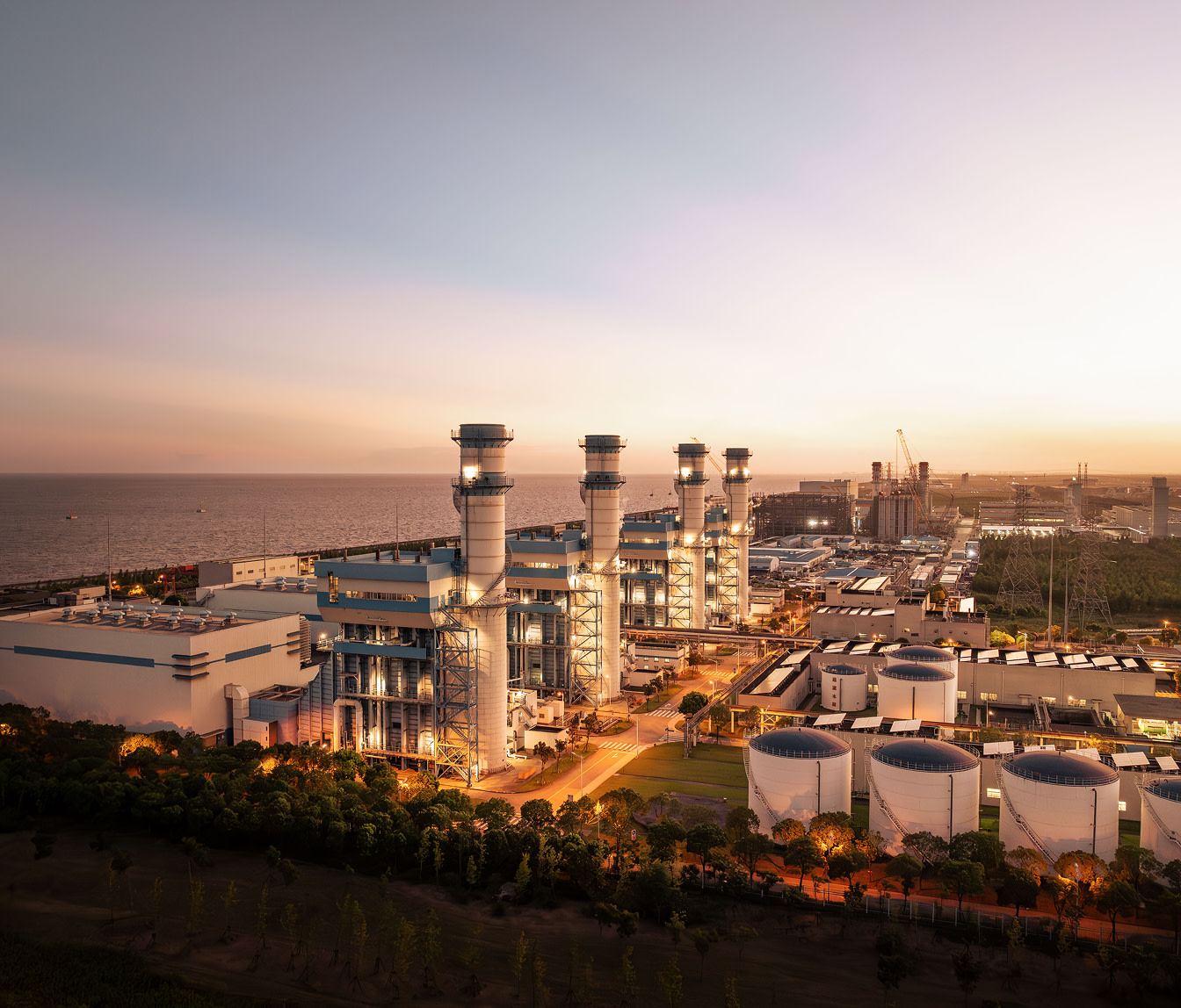 A construction worker holding a tablet on site