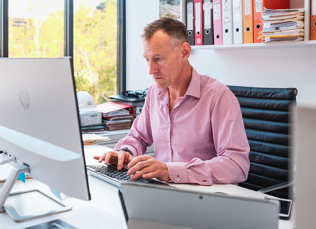 Office worker using his computer