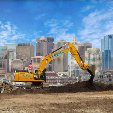 CAT excavator overlooking the city