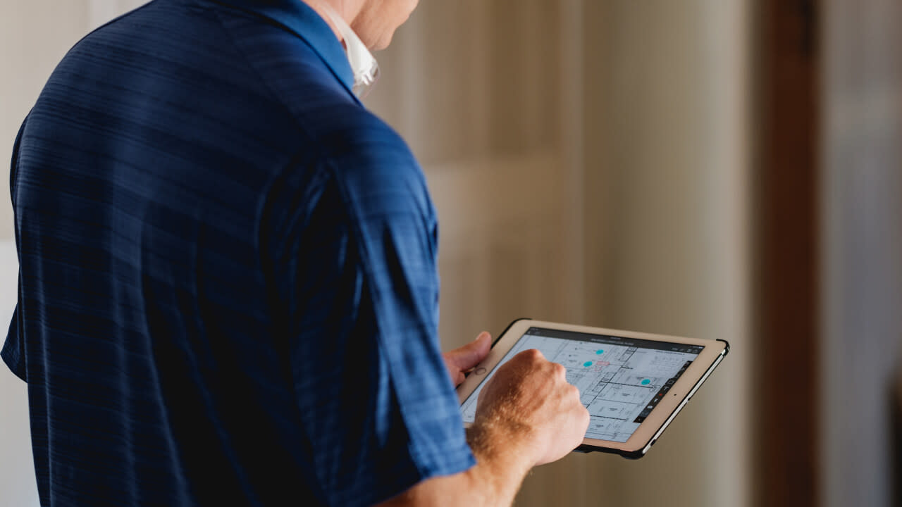 Construction workers on an iPad