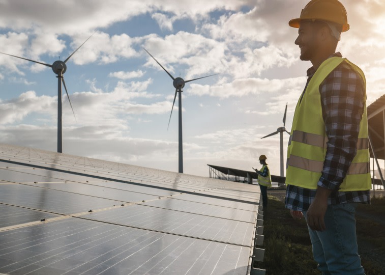 A man standing next to a solar panel area