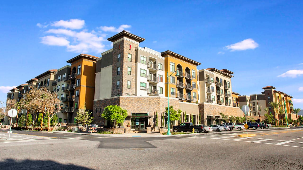 Low angle view of brick and yellow apartment complex