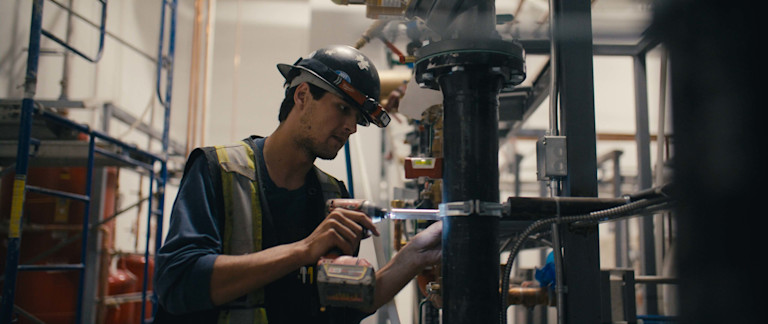 Pitt Meadows employee working on pipes
