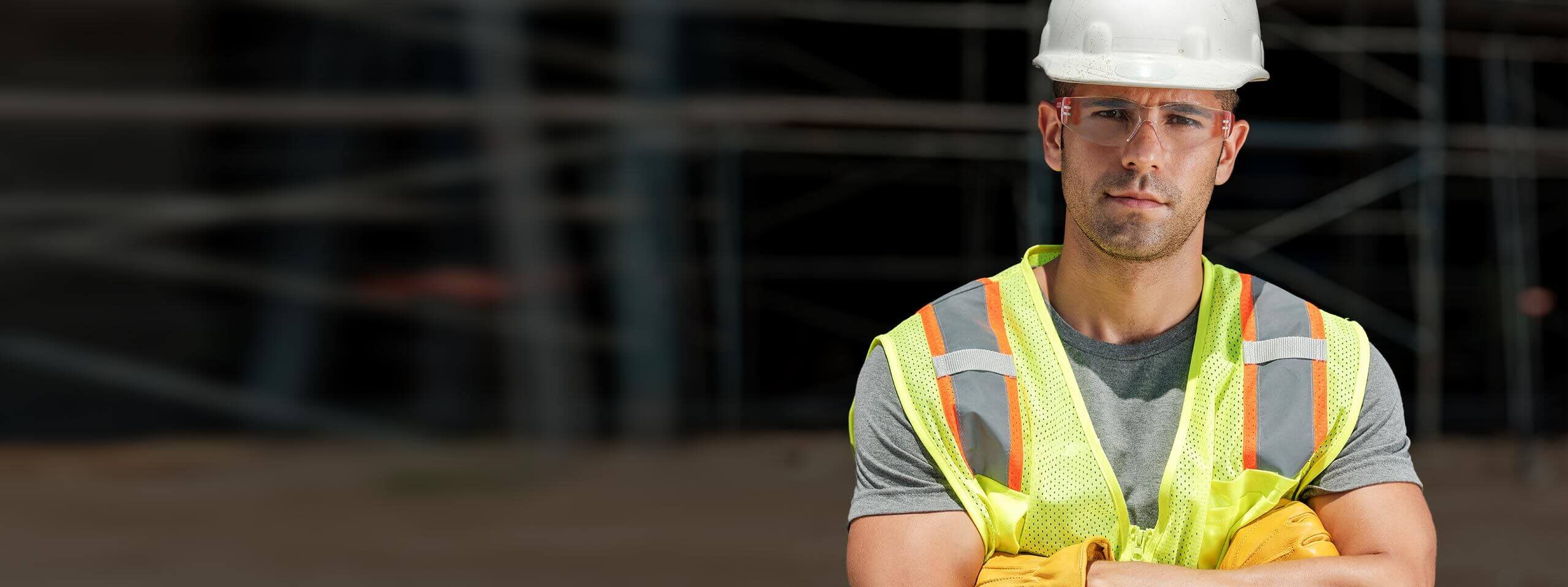 Construction worker with arms crossed