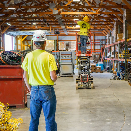 Two men in a warehouse