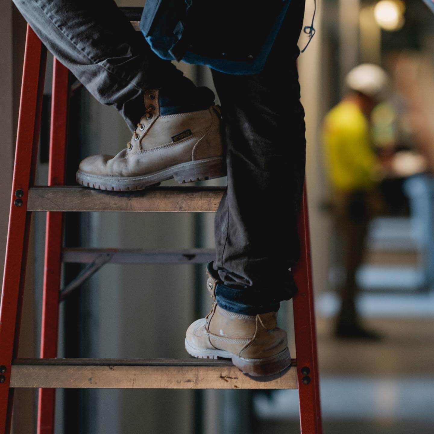 Construction worker on a ladder