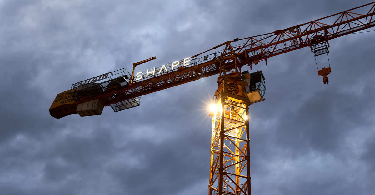 A crane with Shape's logo in it