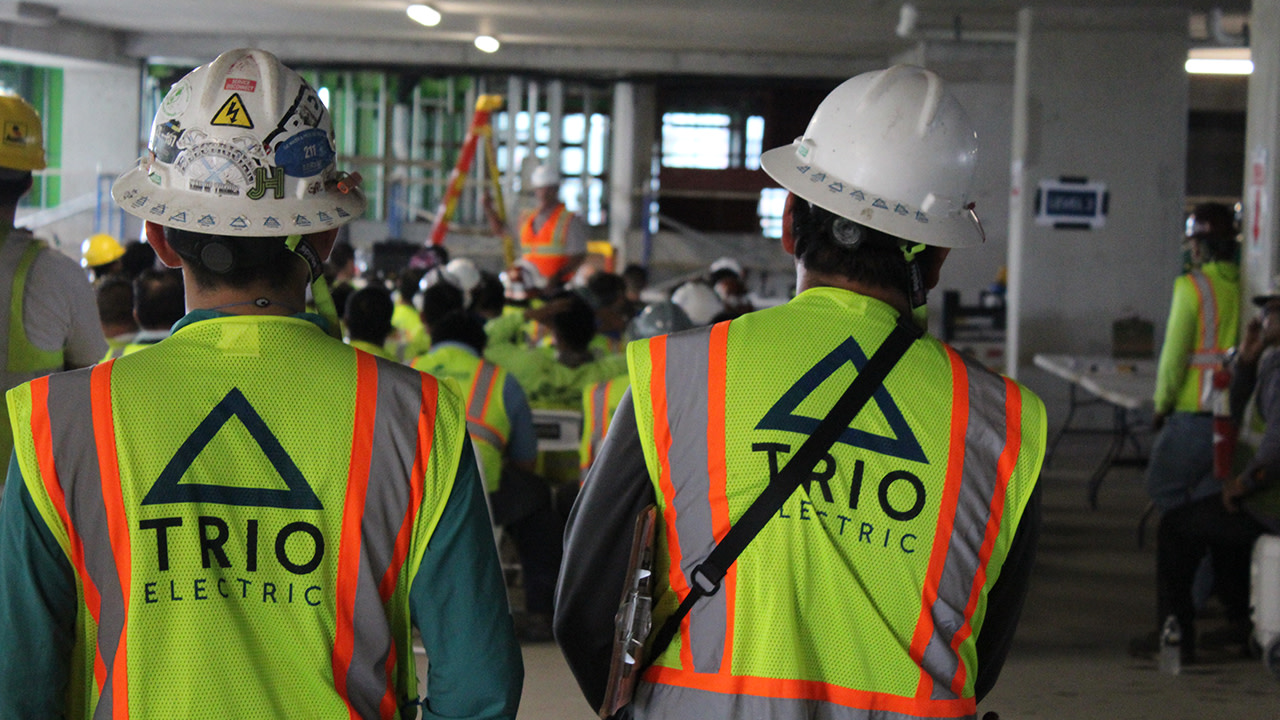 TRIO Electric construction workers listening to a conference