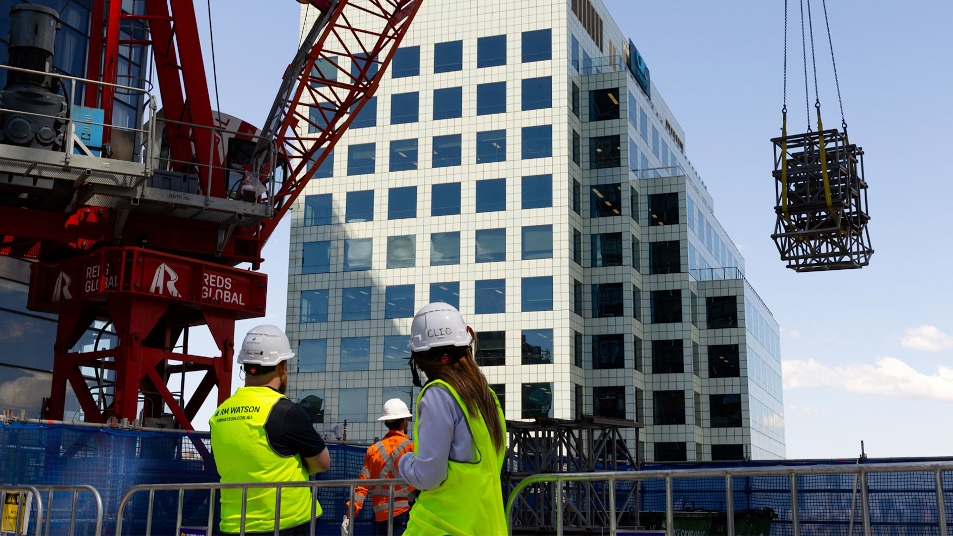 RM Watson’s Health and Safety Adviser Clio Devlin on site at Metro Residences Chatswood, where she uses Procore to manage safety inspections, access equipment and reporting across a complex live-site remediation project.