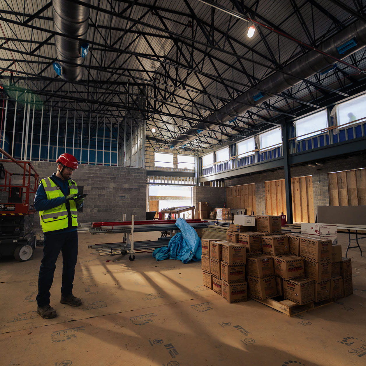 A contractor using a tablet on site