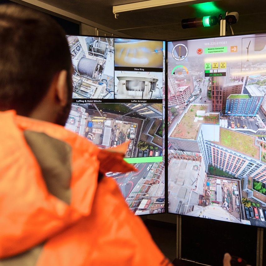 A contractor looking at a BIM project in three screens
