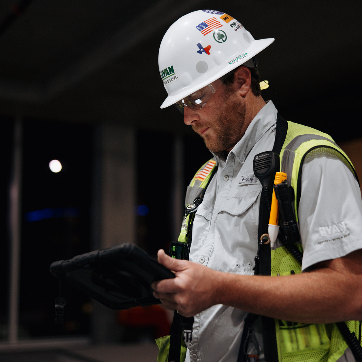A construction worker using a tablet