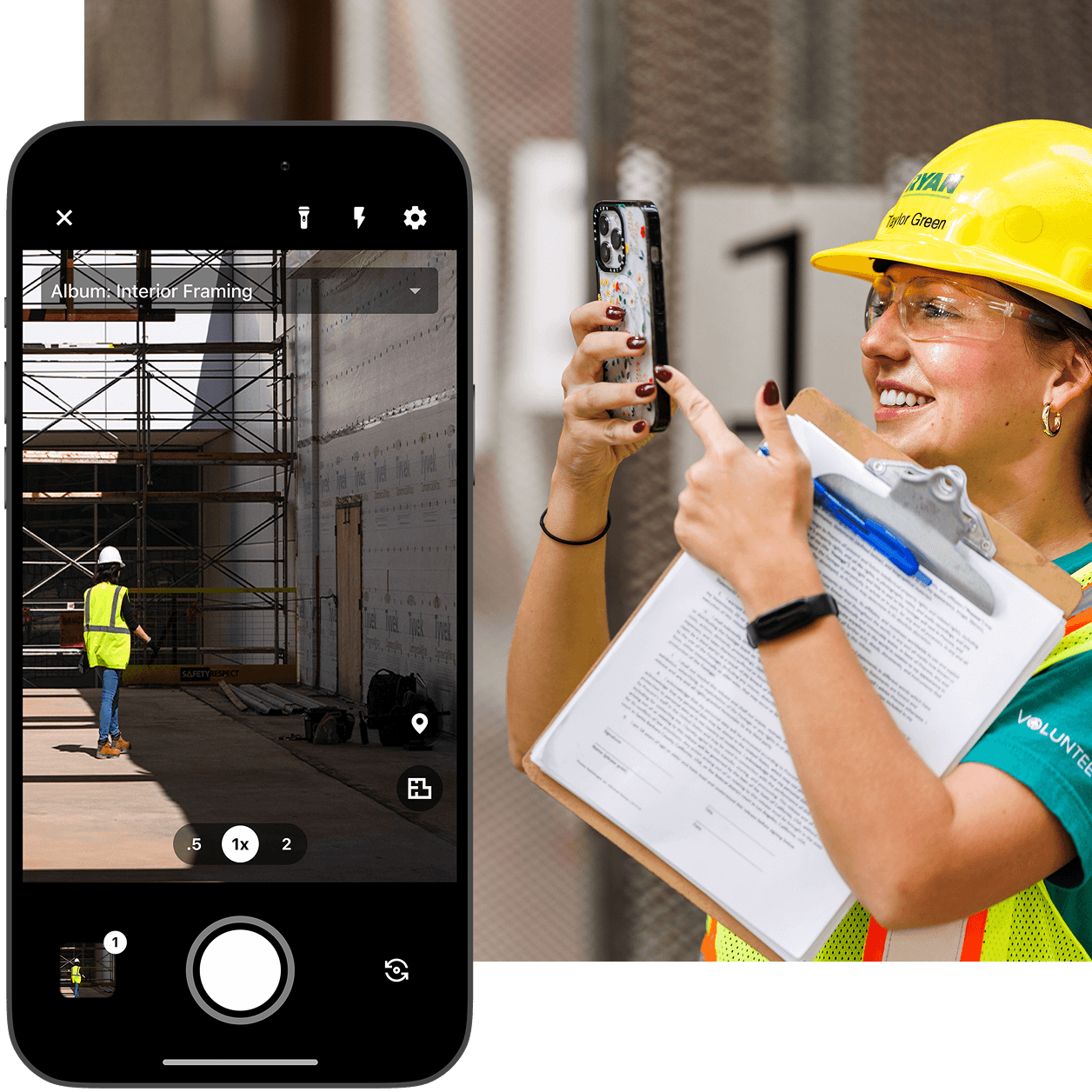 A woman contractor taking a picture of a construction site with her phone