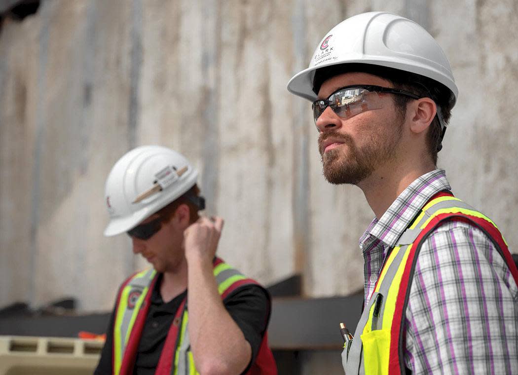 Contractors inspecting a site