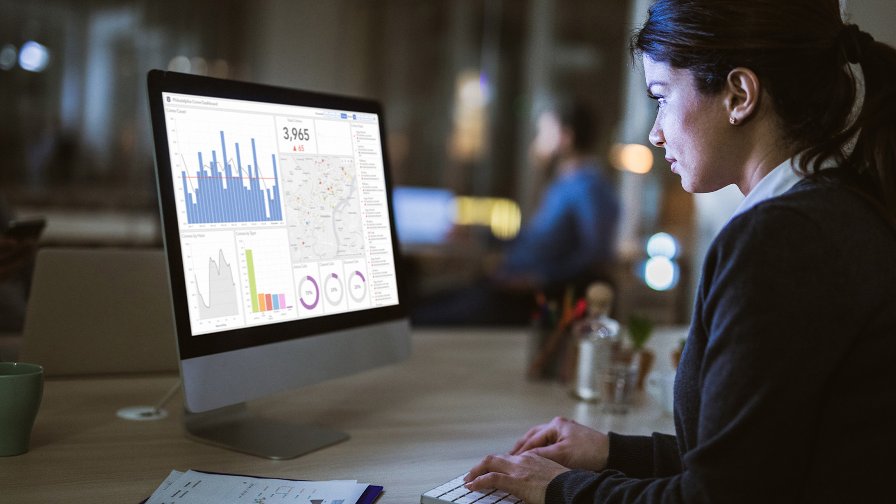 A woman looking at a computer screen