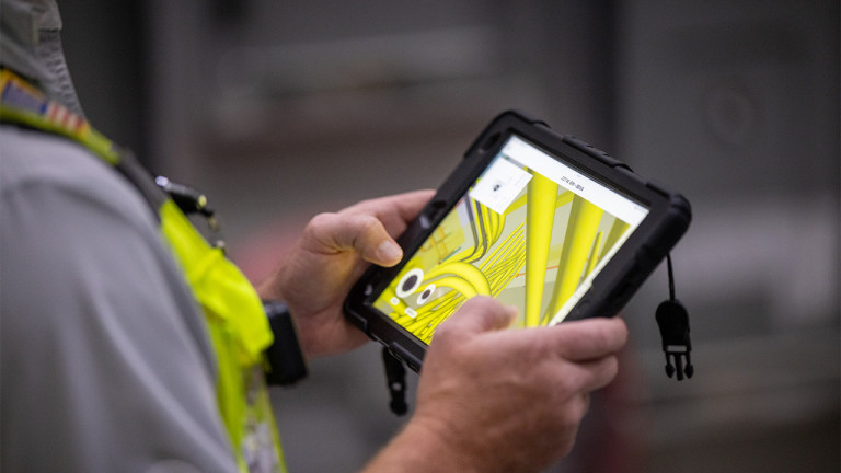 Close up of a man using a tablet