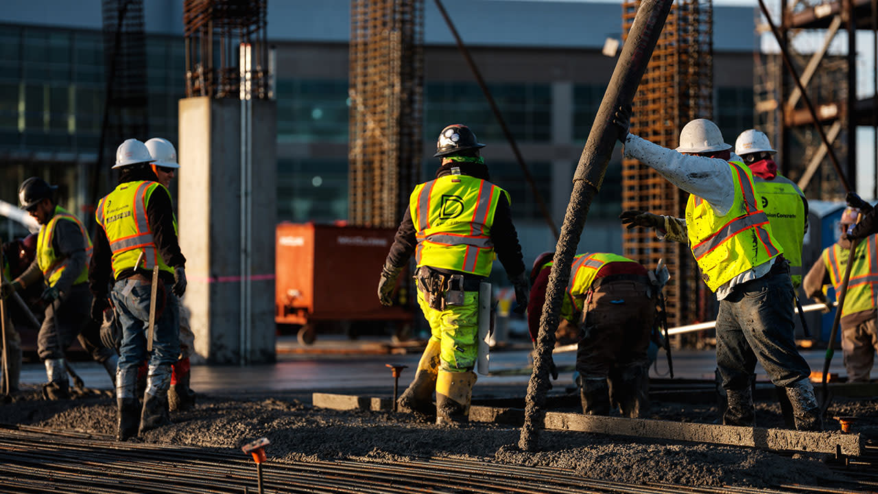 Dolan workers pouring concrete