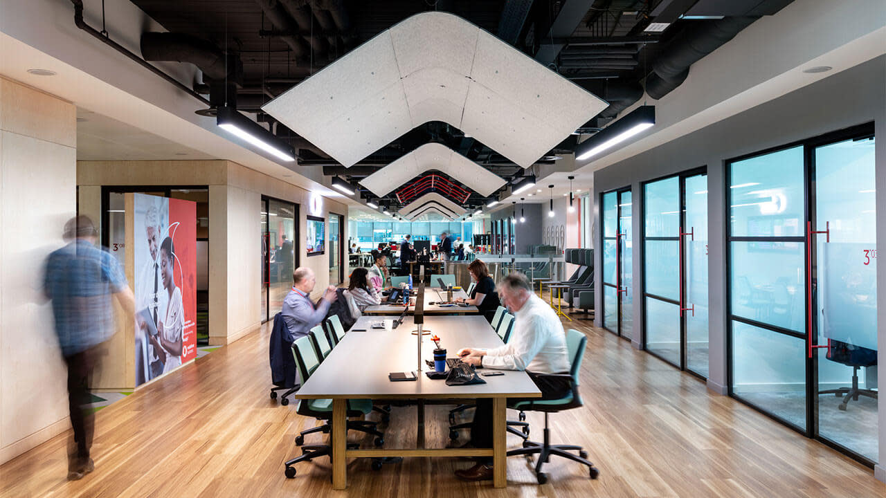 Office workers in their tables