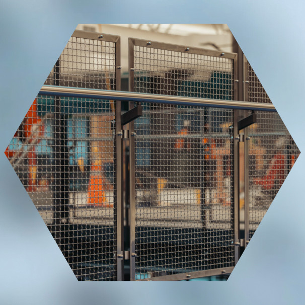 Two construction workers on suspended scaffold cleaning glass facade