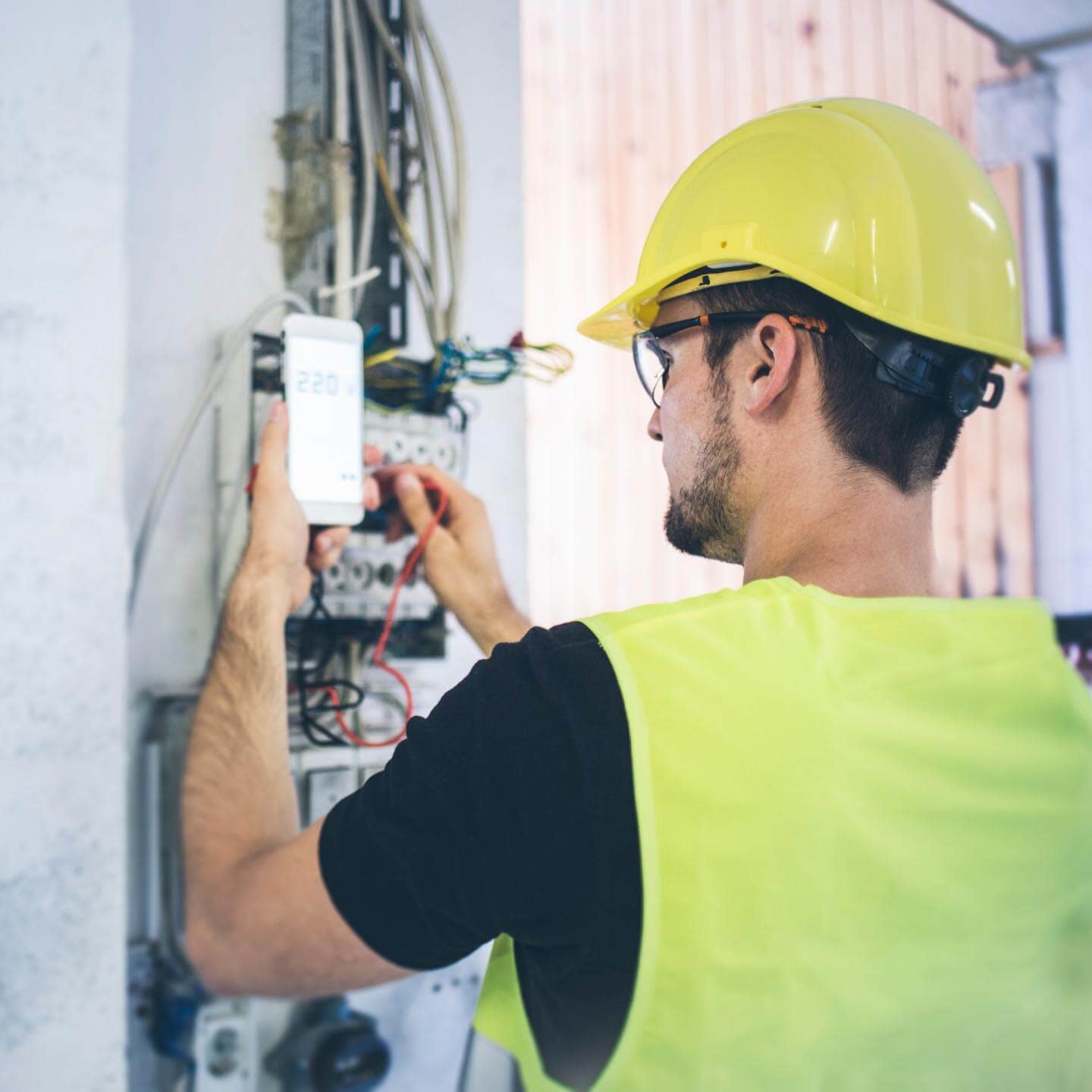 Construction worker setting up the electrical box