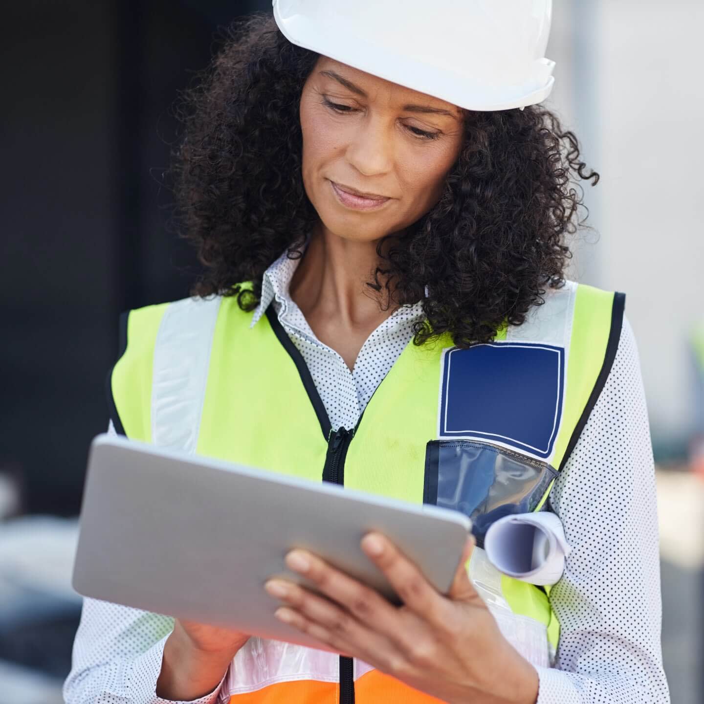 Construction worker looking at iPad