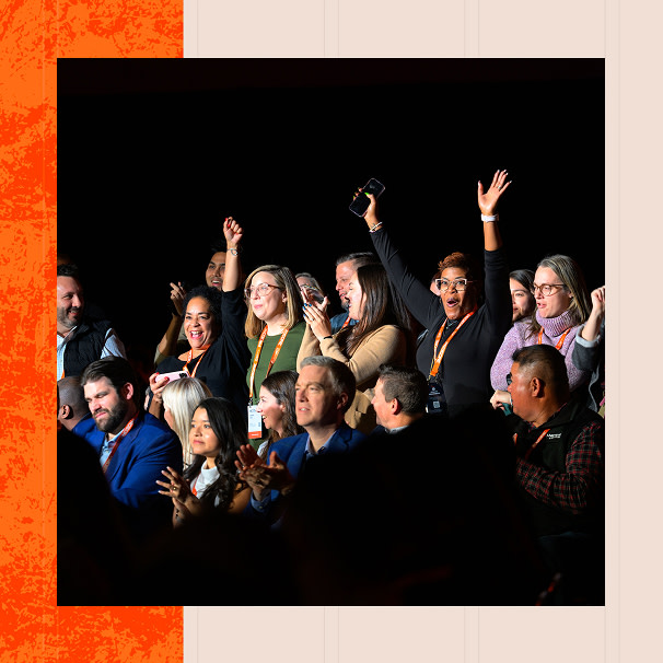 Groundbreak attendees clapping and raising their hands