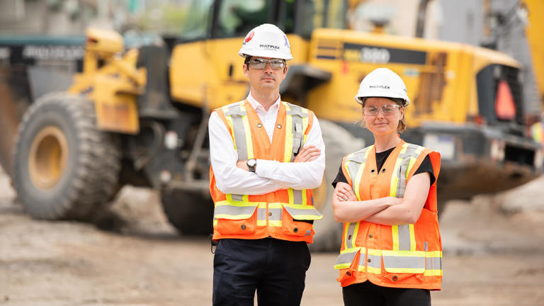 Multiplex contractors posing for the camera on a construction site