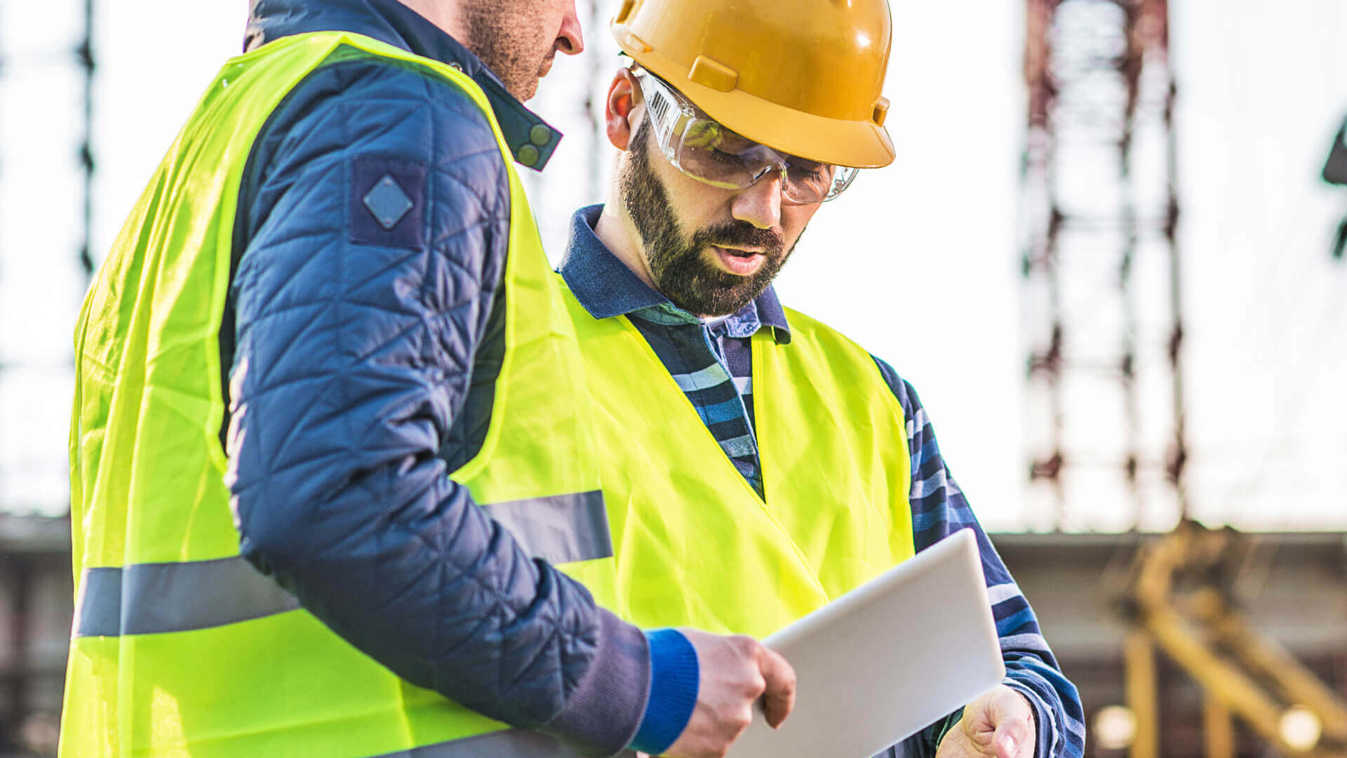 Construction workers discussing the workload